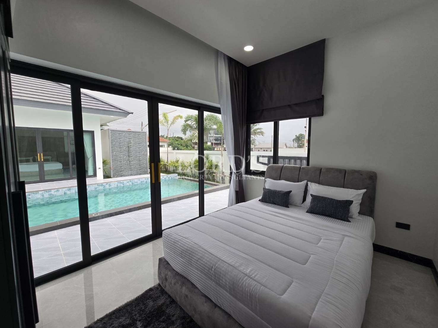 Bedroom with bed and glass sliding doors