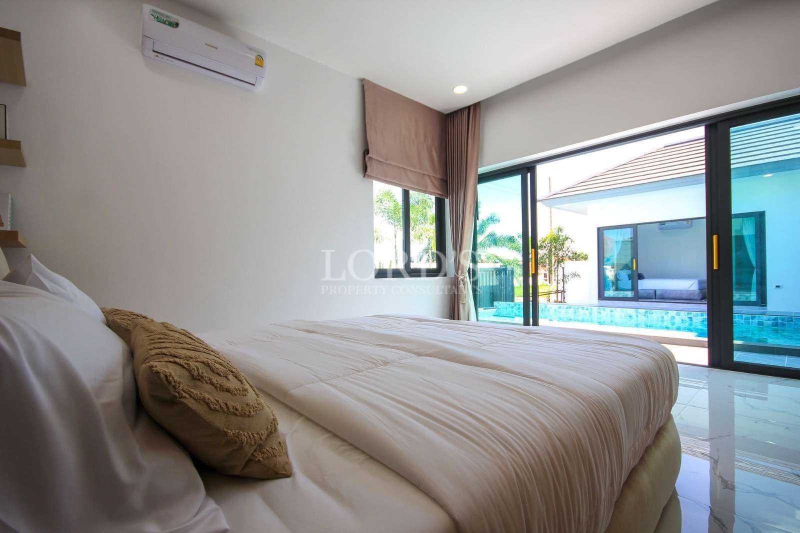 Bedroom with bed and decorative pillows