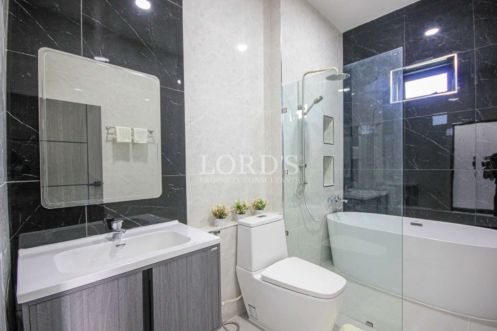 Bathroom with toilet and shower enclosure