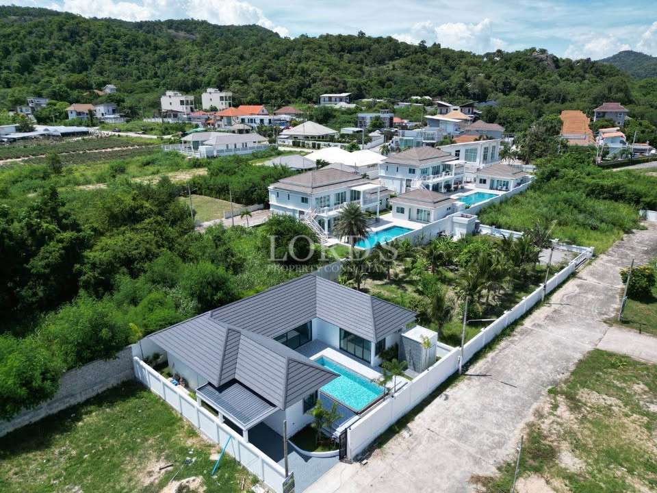 Aerial view of villas and hillside area