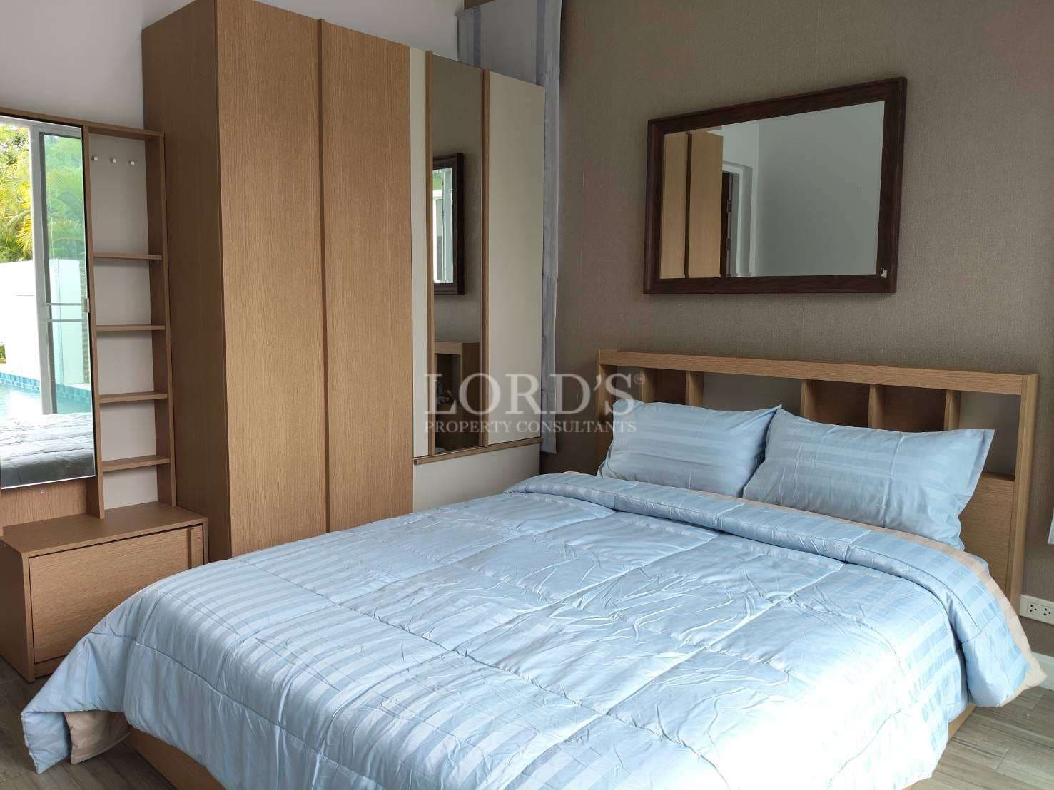 Modern bedroom with light blue bedding