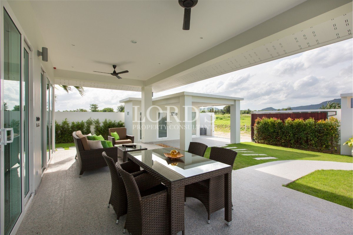 Open-air dining area with garden view