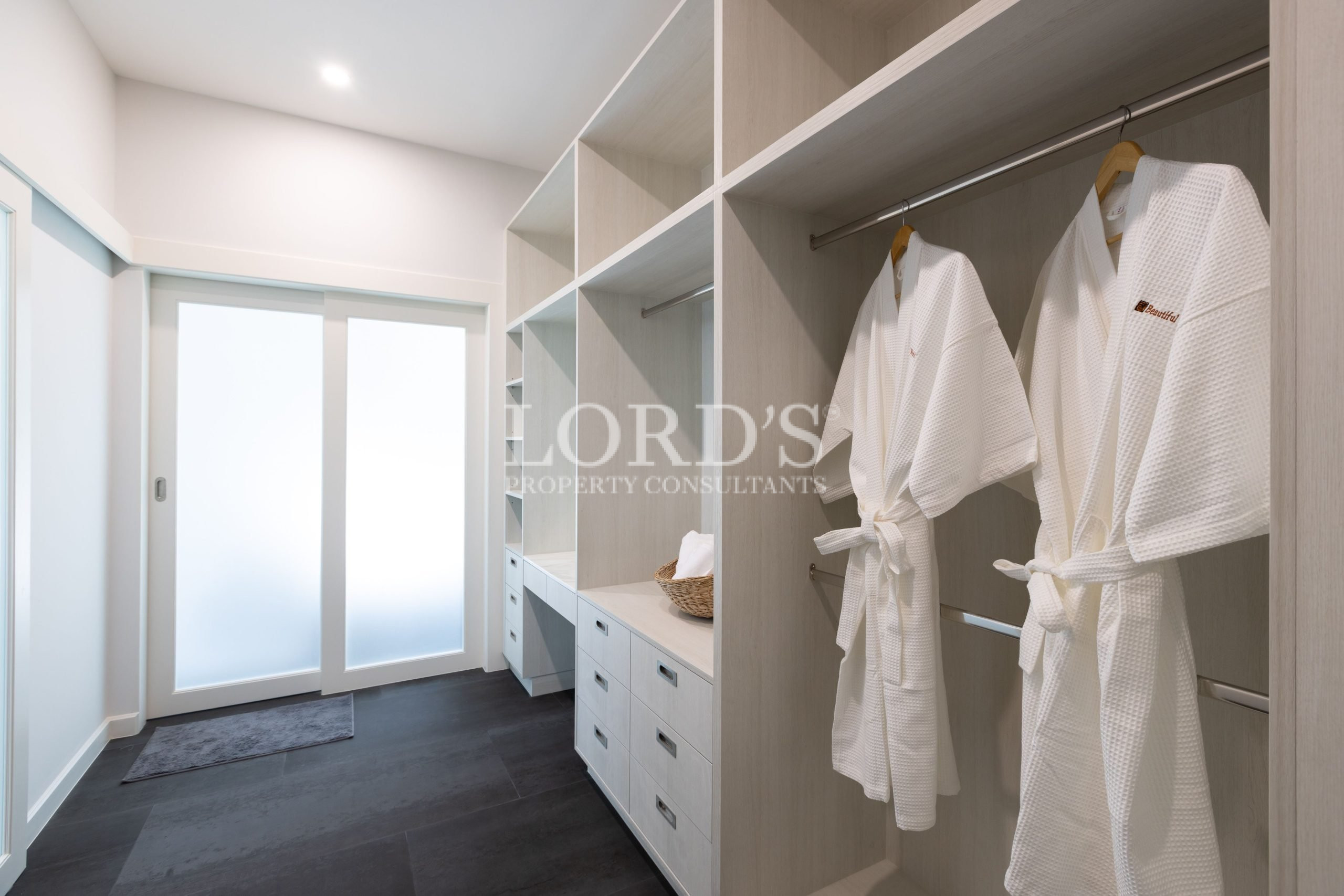 Walk-in closet with storage shelves