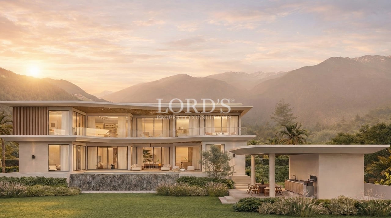 Luxury villa exterior at sunset with garden