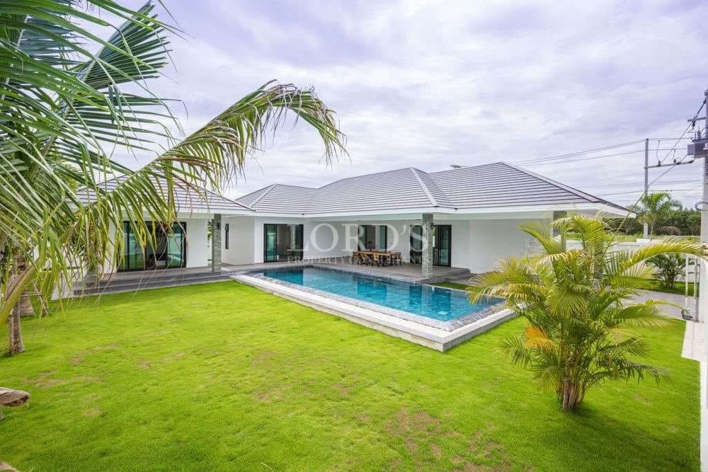 Modern house with pool and greenery