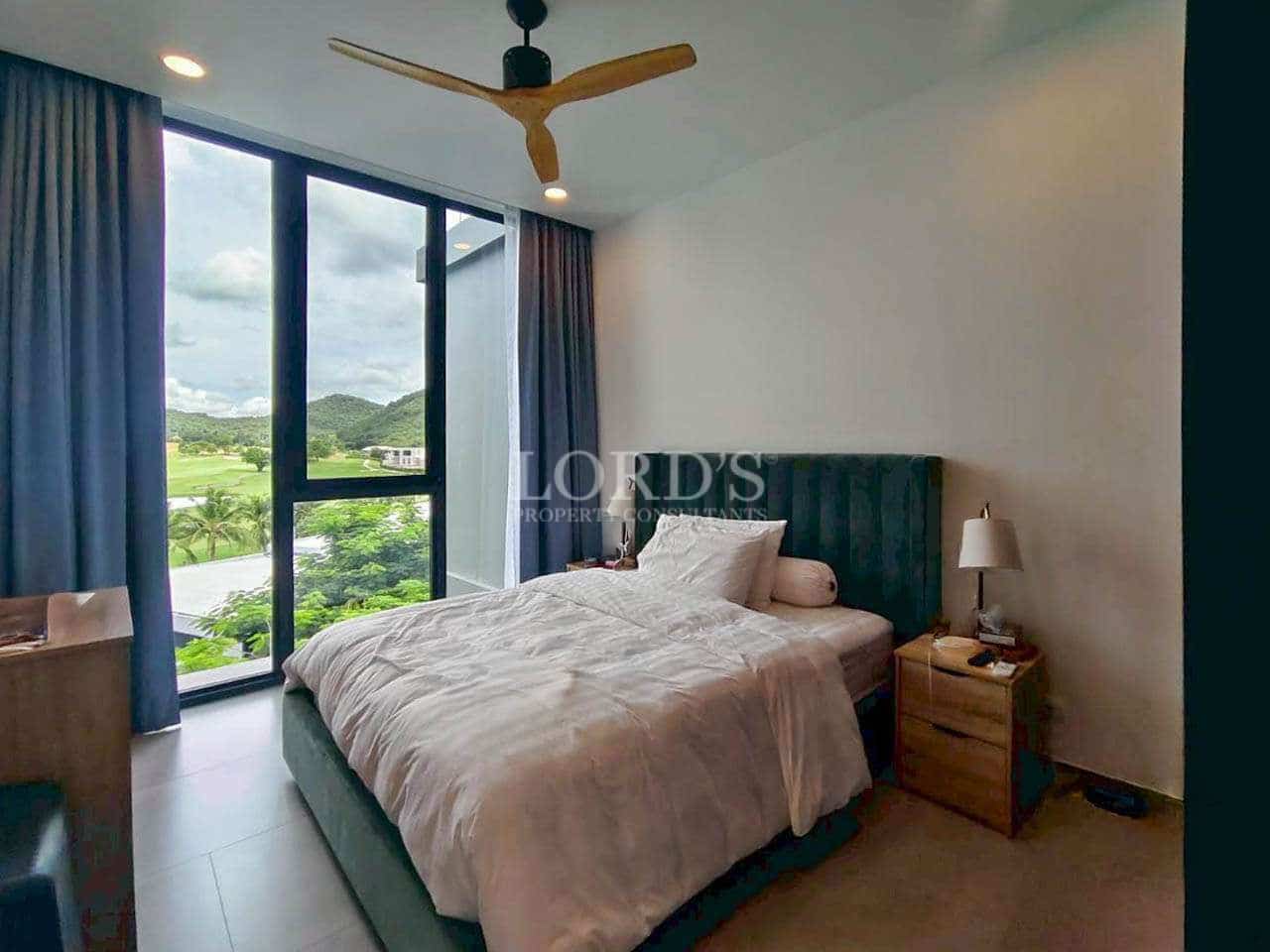 Modern bedroom with large windows