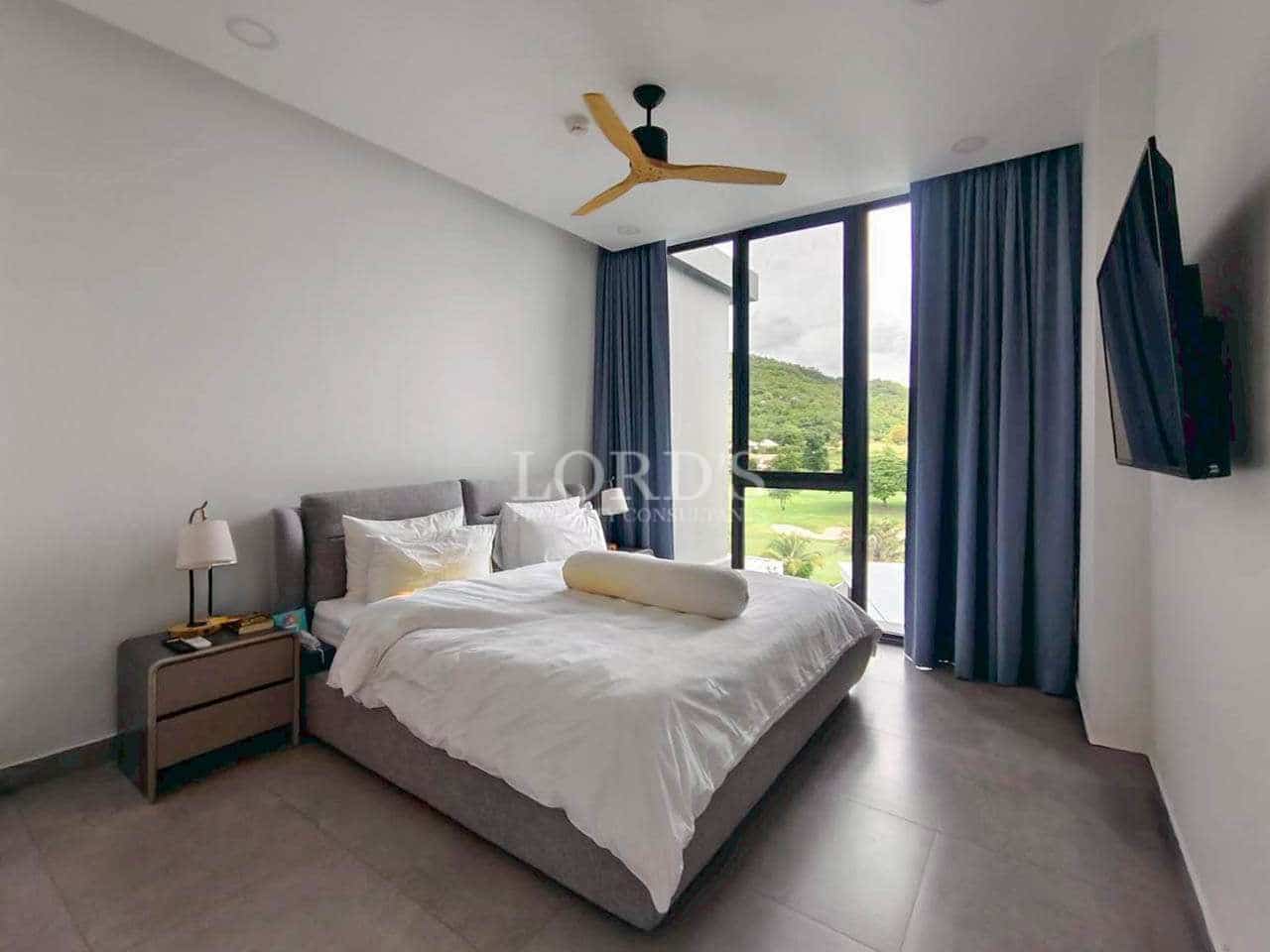 Modern bedroom with large windows