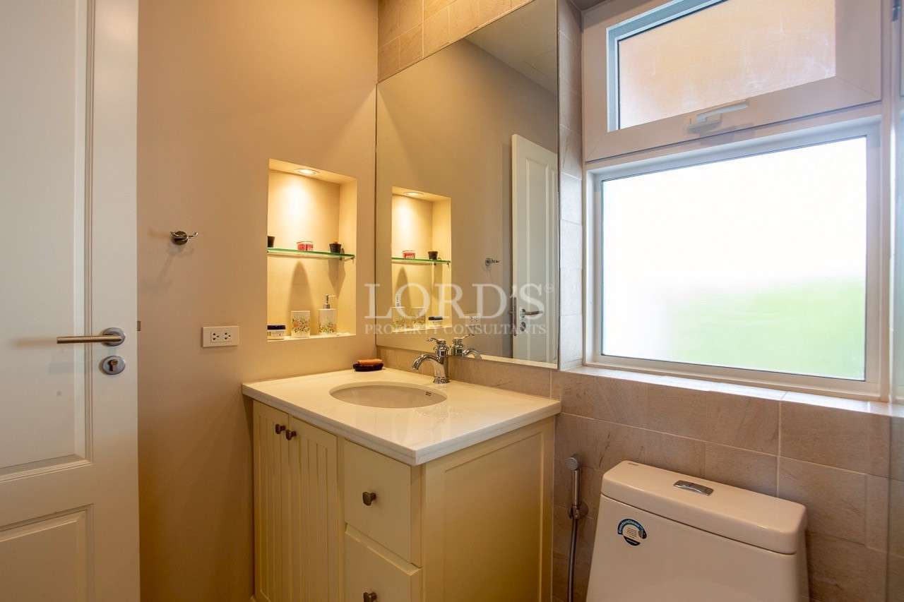 Modern bathroom vanity with mirror and frosted window