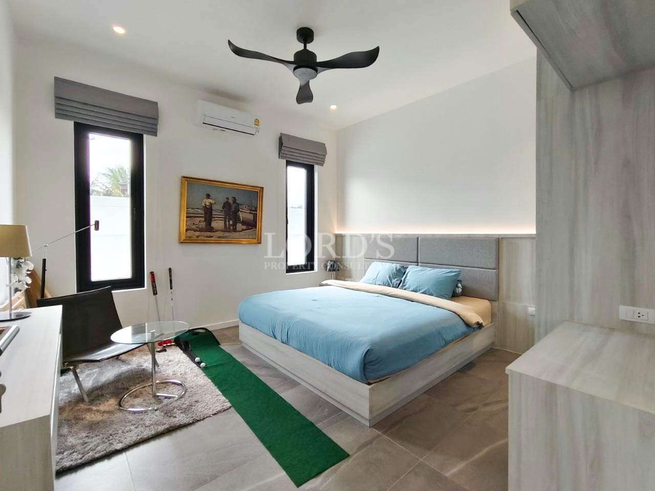 Bedroom with bed and blue bedding