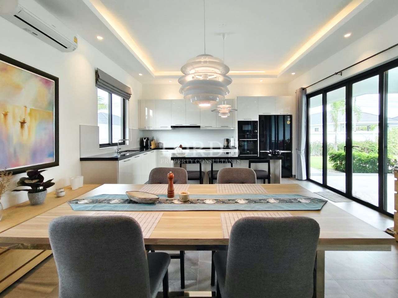 Living room with sofa and open dining