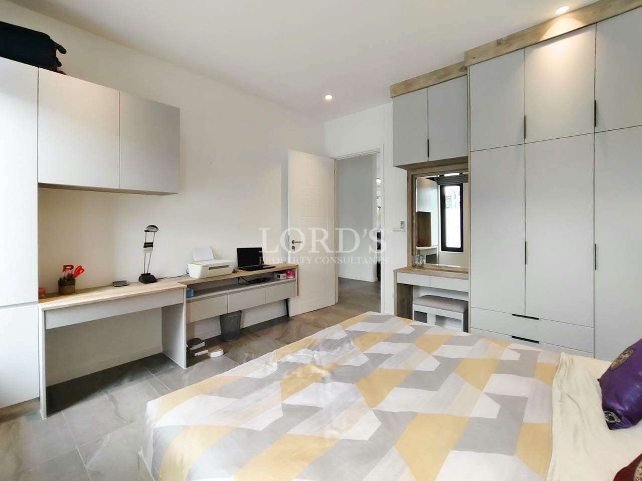 Bedroom with bed and patterned floor