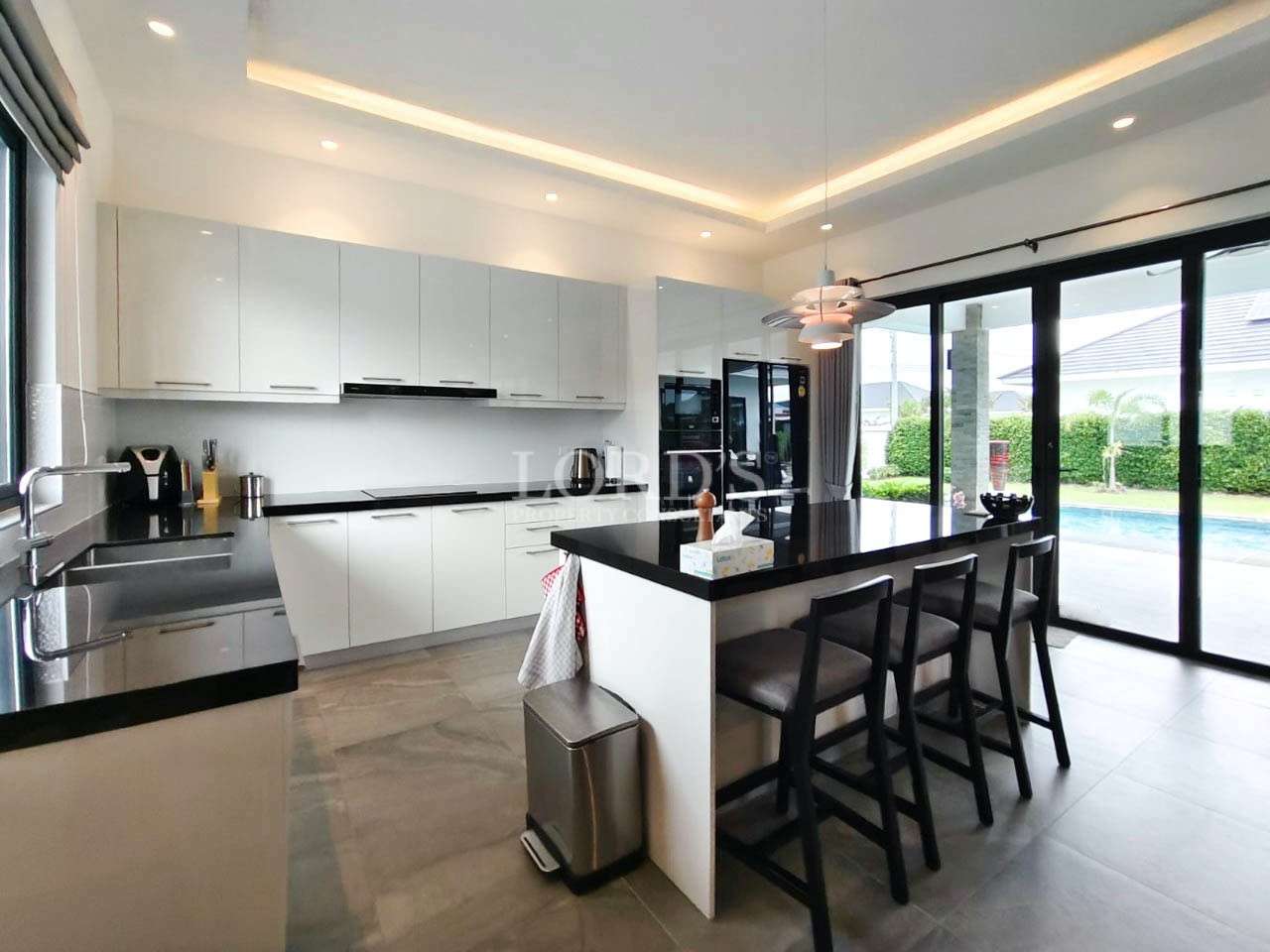 Kitchen with island and bar stools