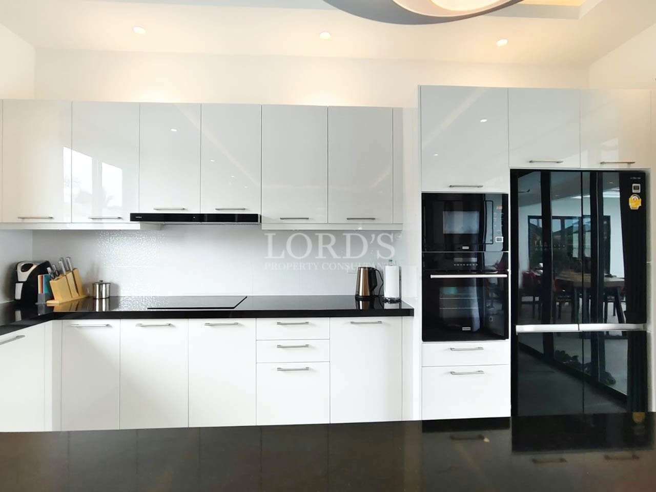 Kitchen with white cabinets and appliances