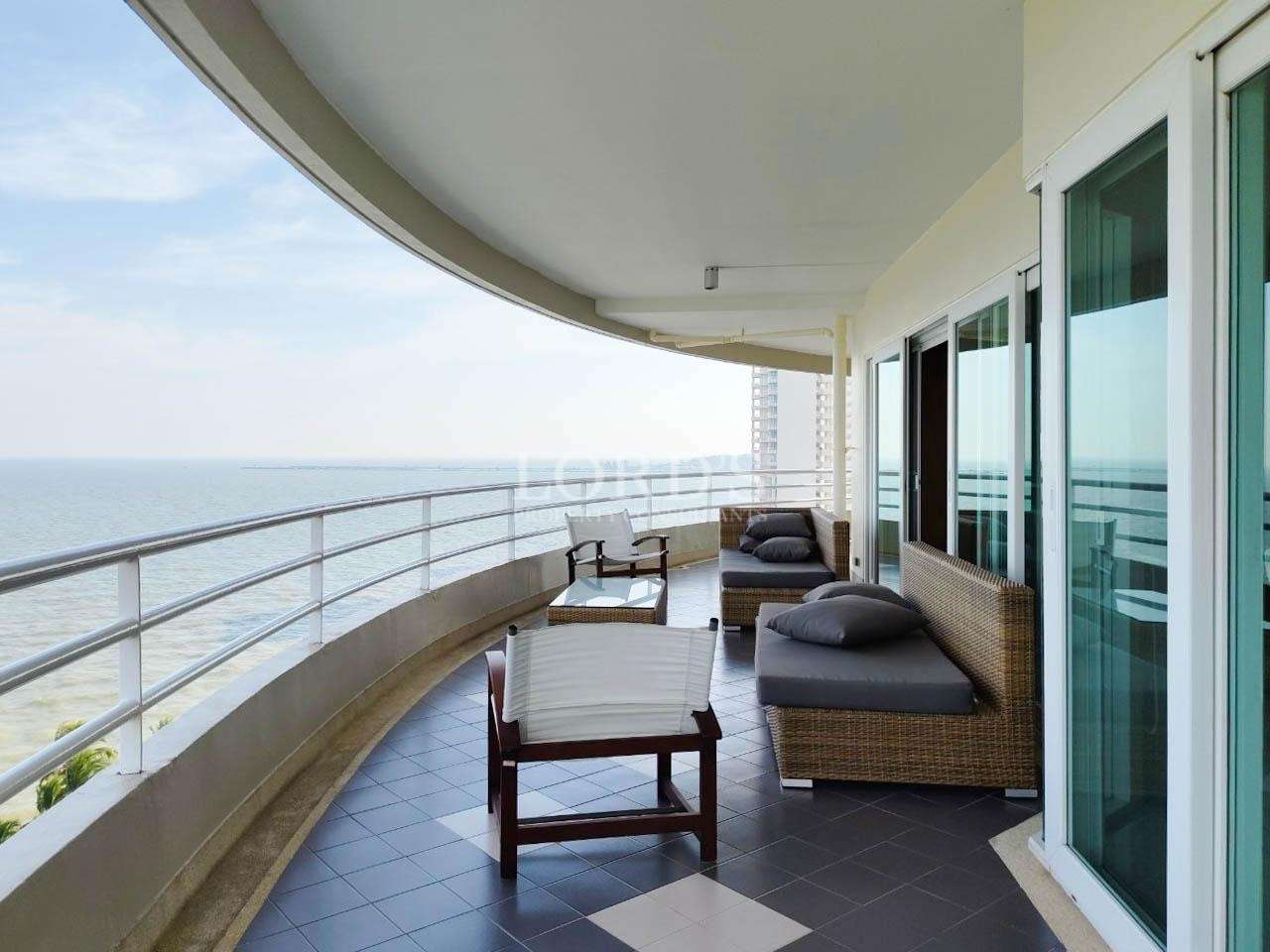 Curved balcony with seating and sea view