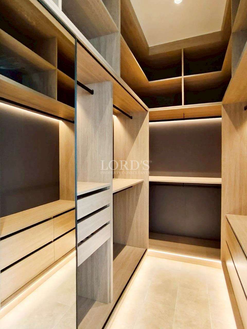 Walk-in closet with wooden shelves