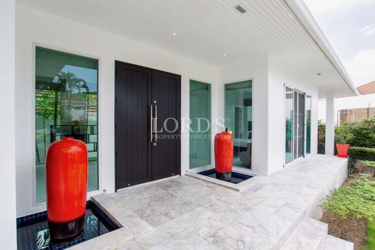 Modern entrance with decorative vases