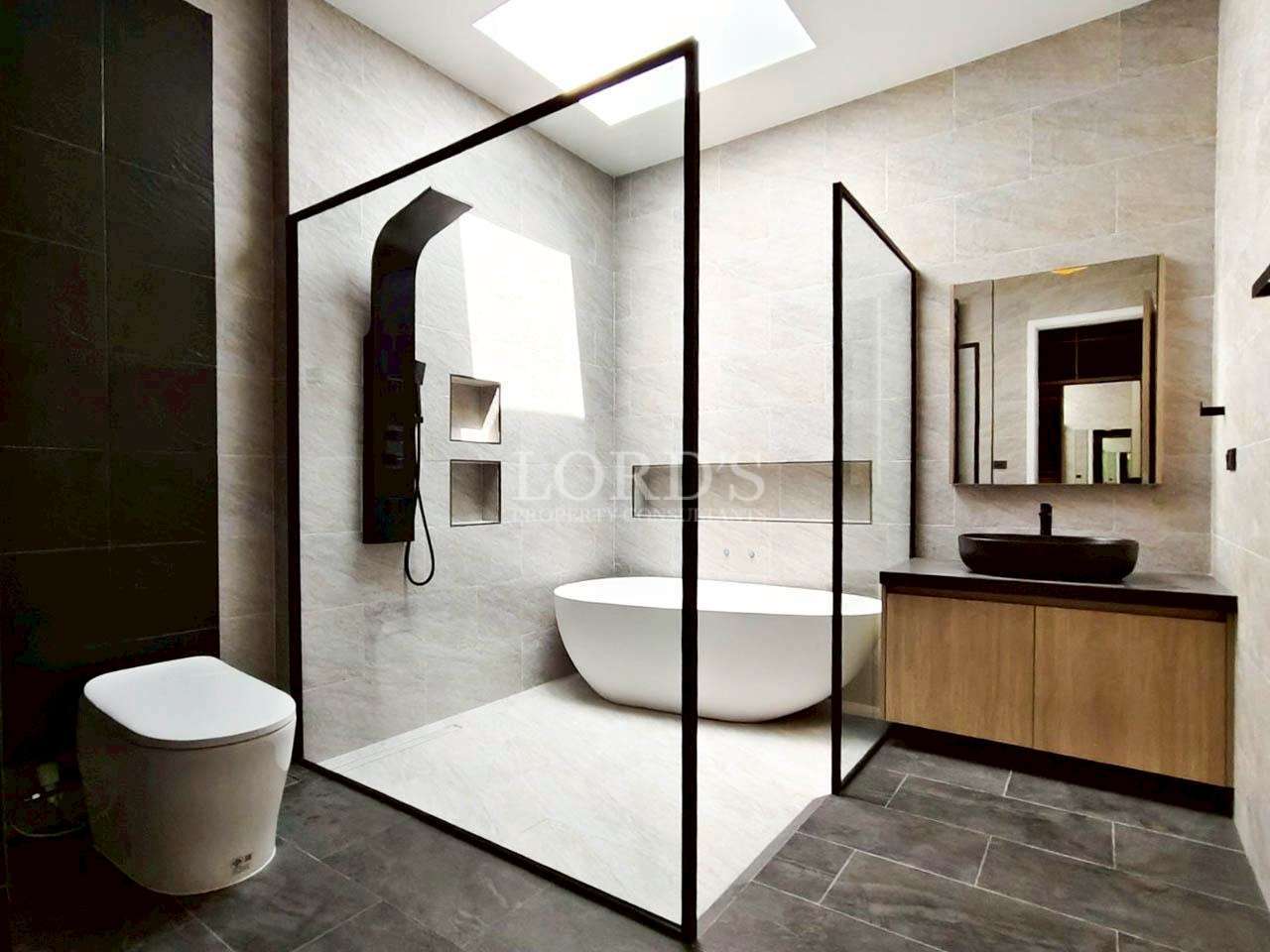 Bathroom with glass shower partition