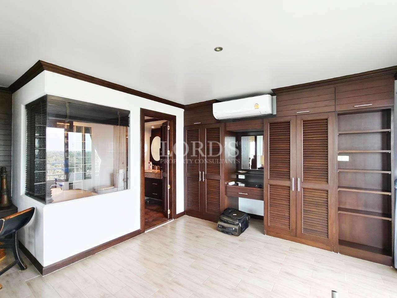 Empty room with wooden wardrobe and floor