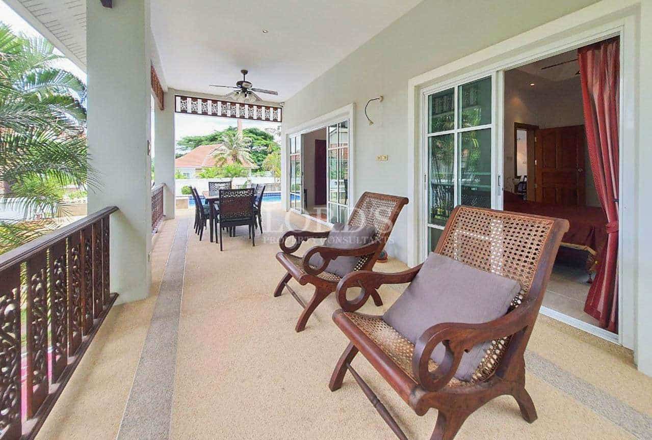 Covered patio with chairs and table