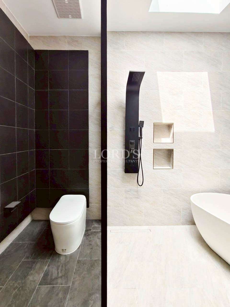 Bathroom with dark accent tiles