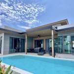 Modern villa with pool and greenery