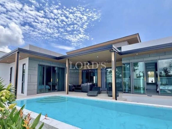 Modern villa with pool and greenery