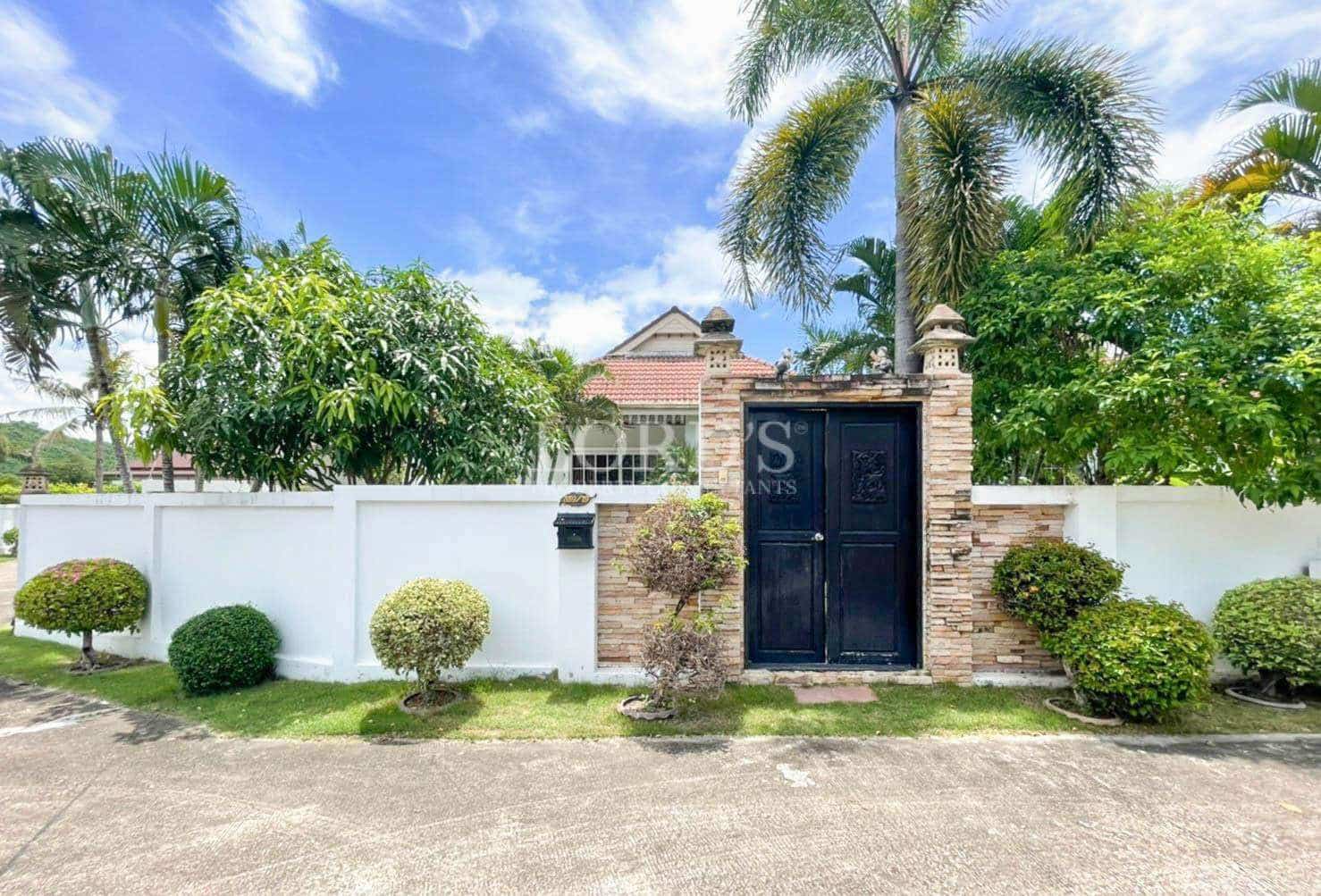 House entrance with garden and gate