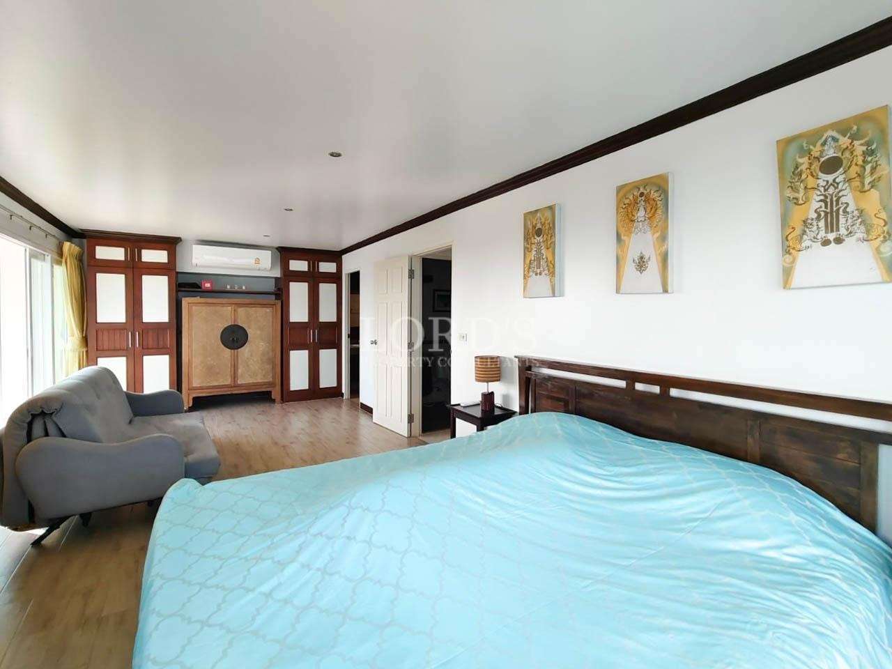 Bedroom with blue bedding and modern design