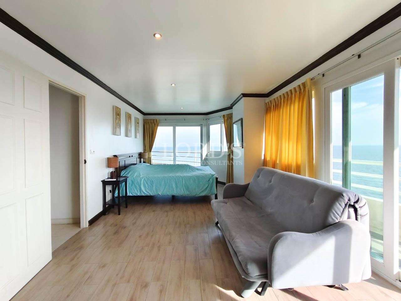 Bedroom with bed and large window