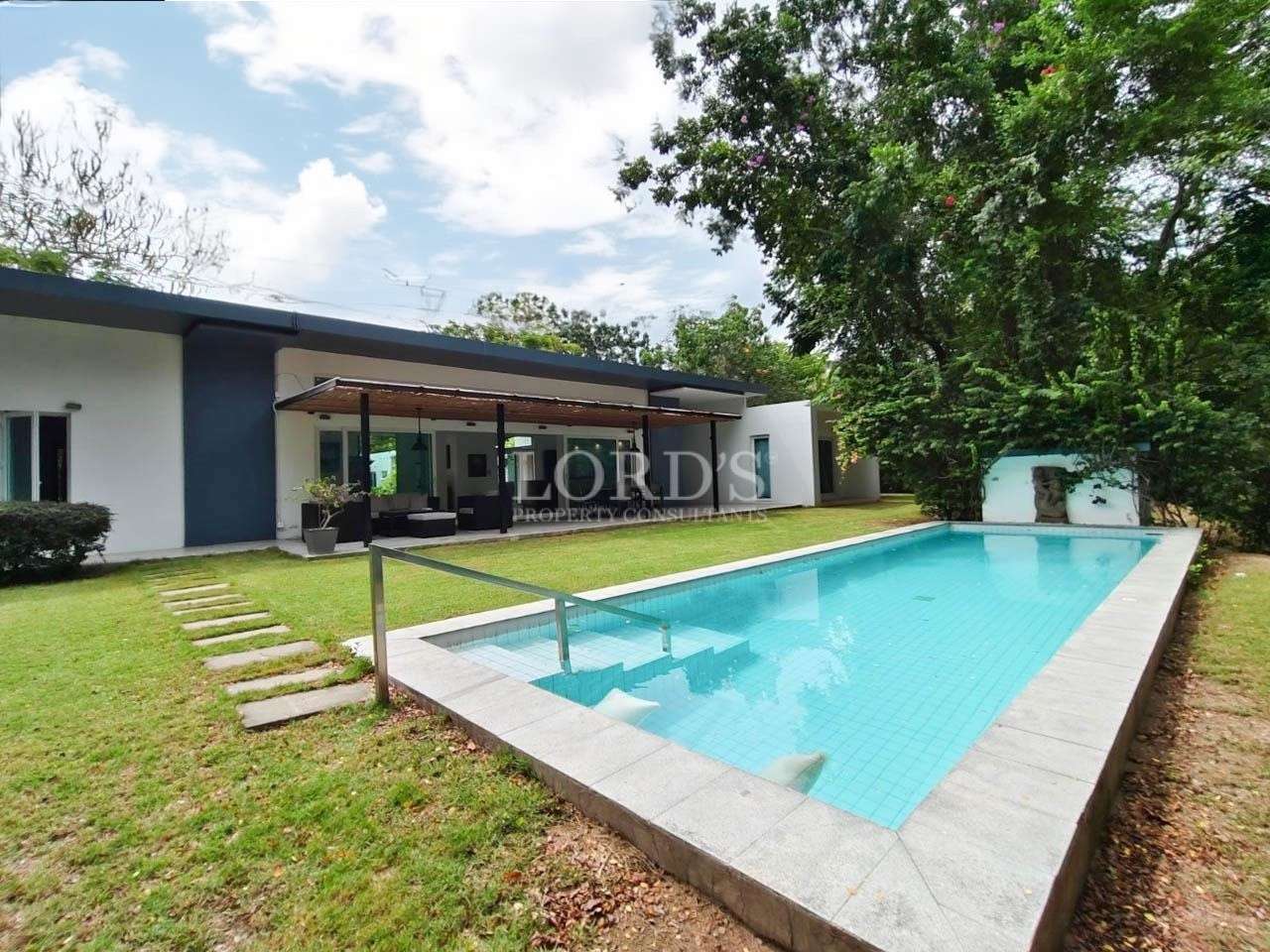 Swimming pool with garden and patio
