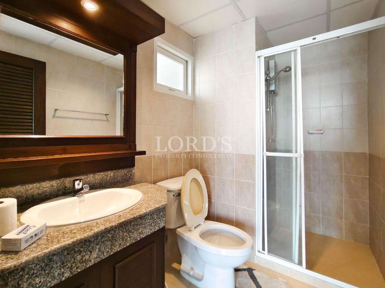 Bathroom with sink, mirror, and shower