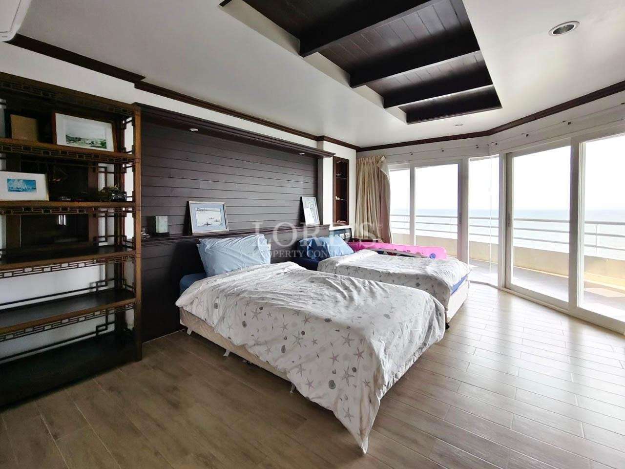 Bedroom with large windows and sunlight