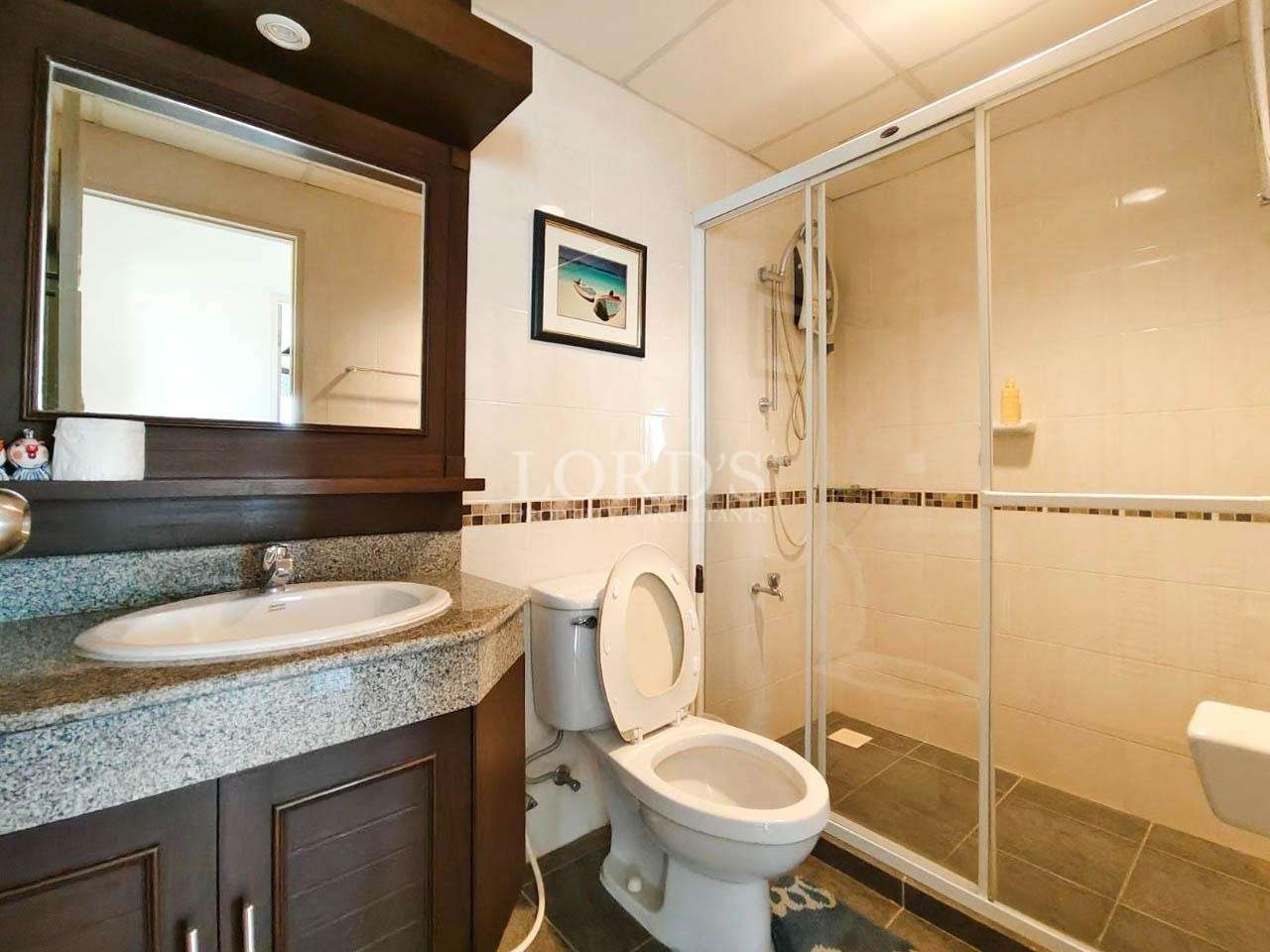 Bathroom with glass shower and vanity