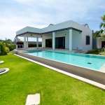 Modern villa with private swimming pool, landscaped garden, and covered terrace.