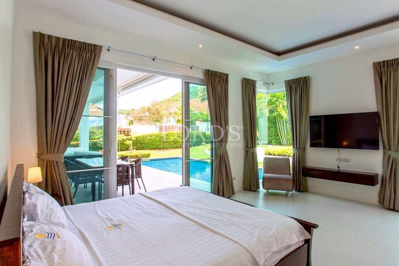 Modern bedroom with pool view