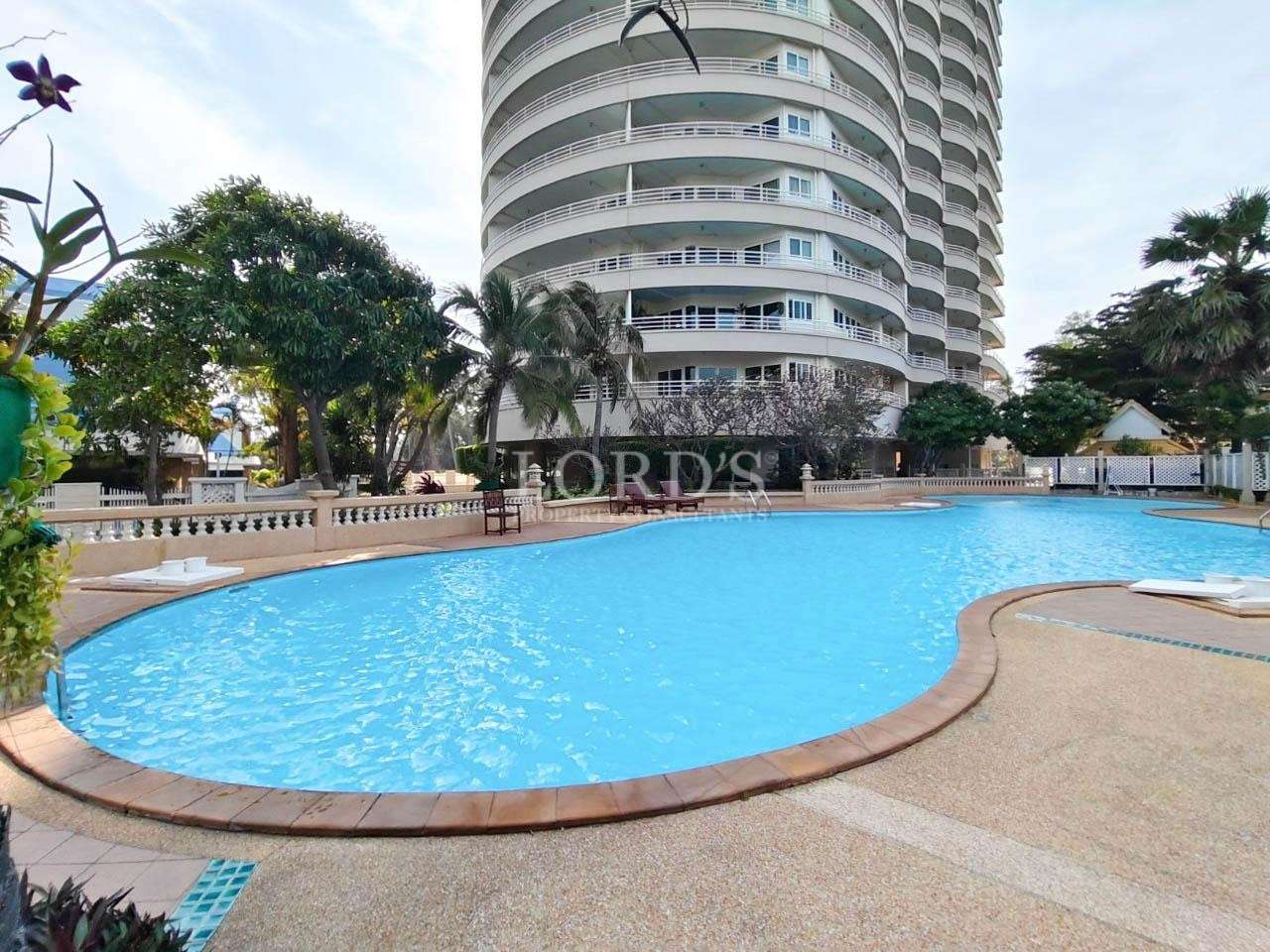 Swimming pool beside high-rise building