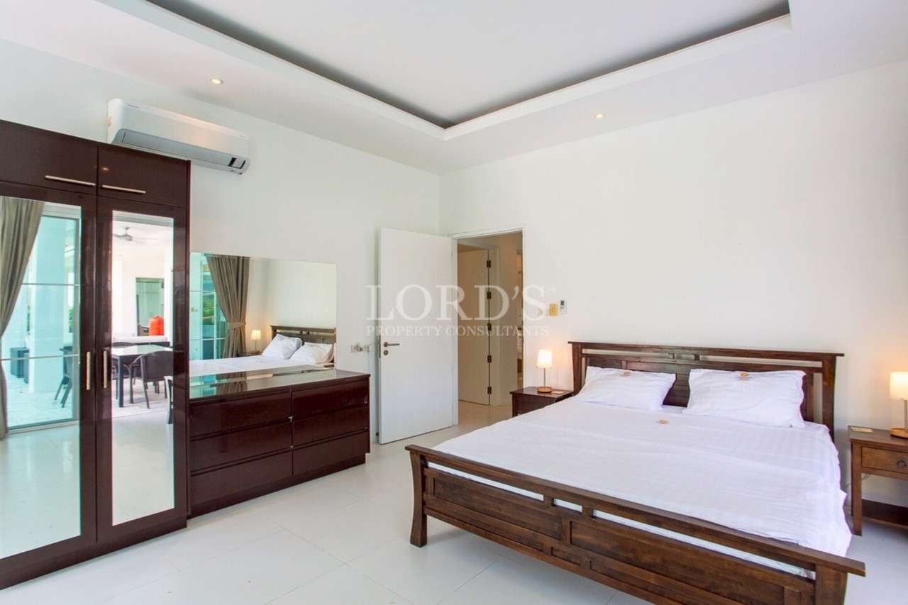 Modern bedroom with wooden furniture