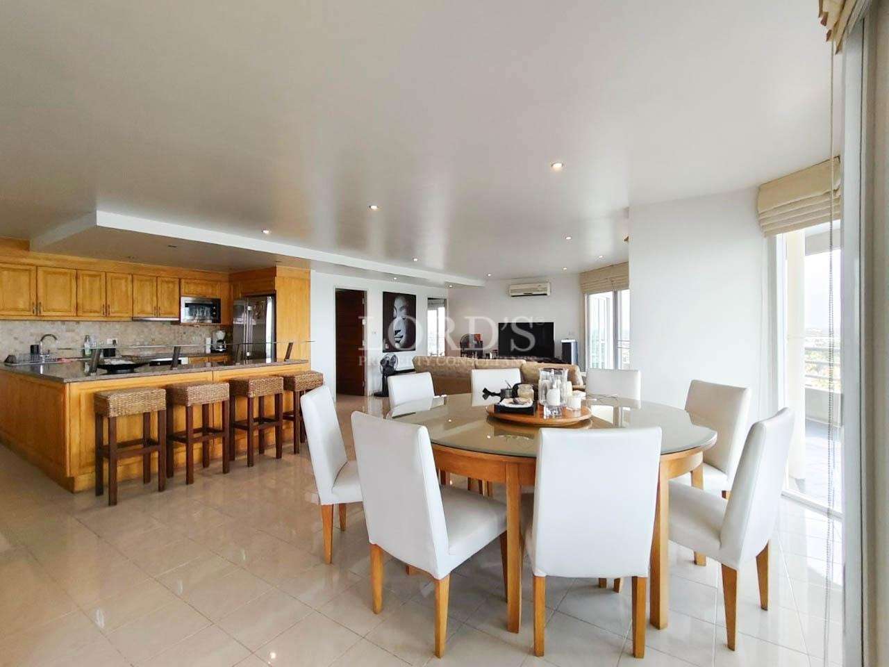 Dining space with table and chairs near kitchen