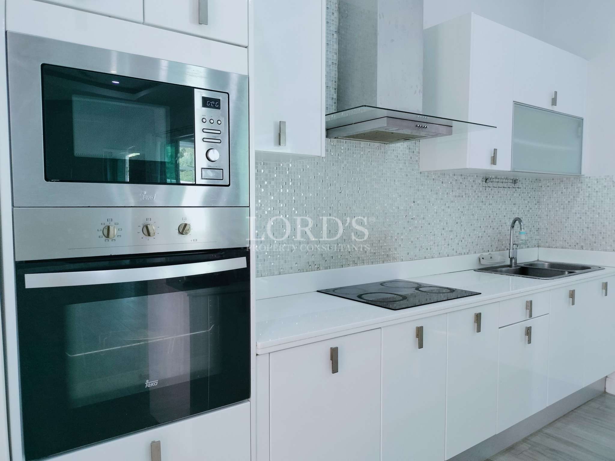 Modern kitchen with sleek appliances.