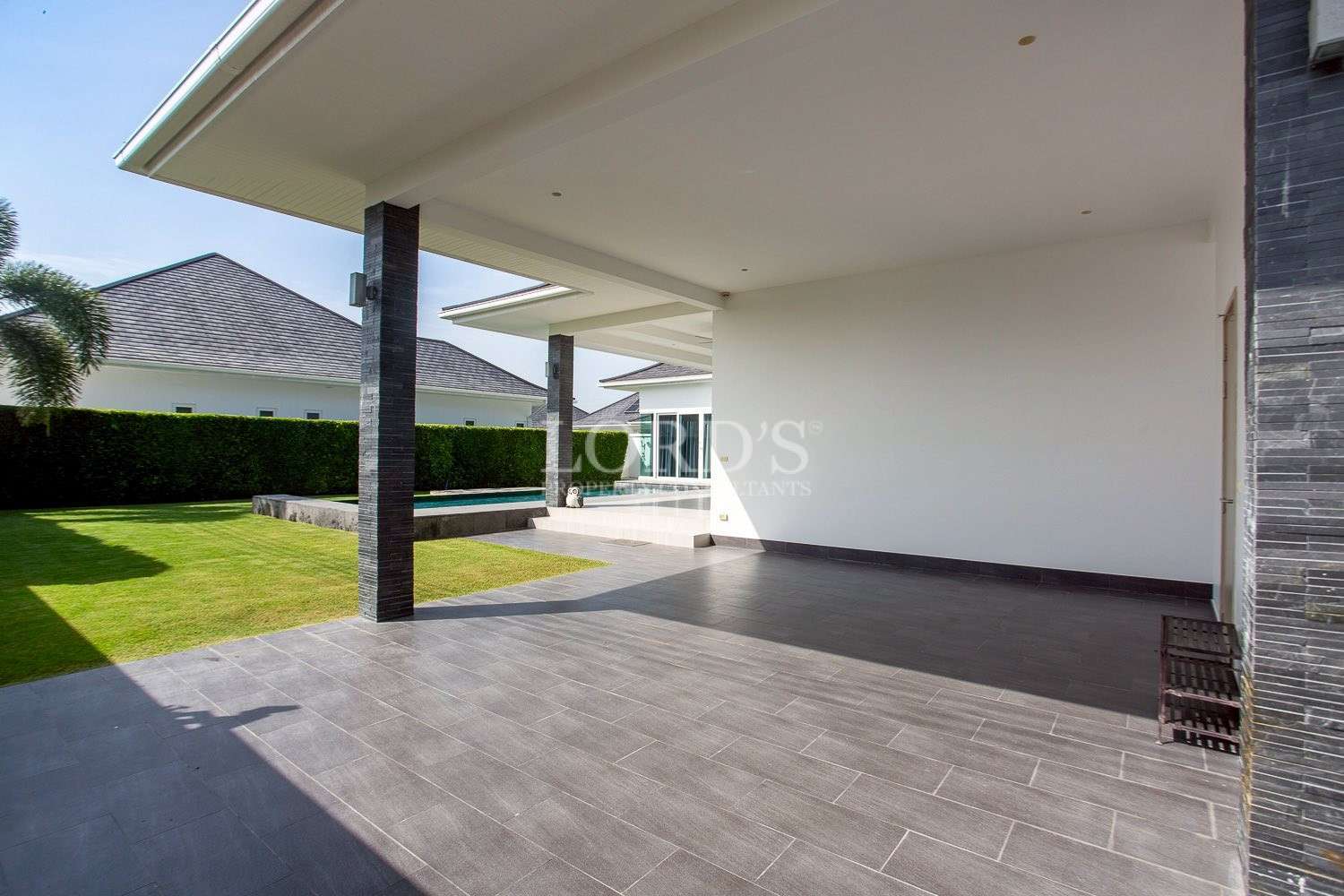 Covered driveway with concrete floor