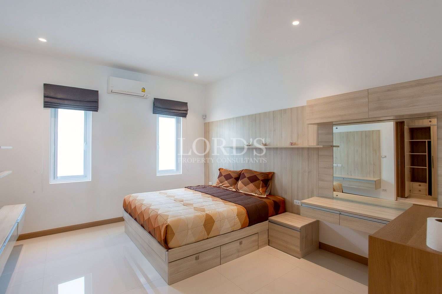 Bedroom with bed and soft furnishings