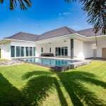Villa exterior with lawn and garden