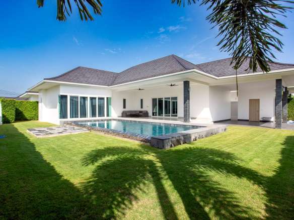 Villa exterior with lawn and garden