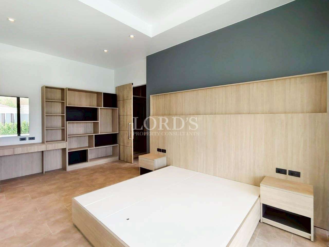 Bedroom with wooden wall panels