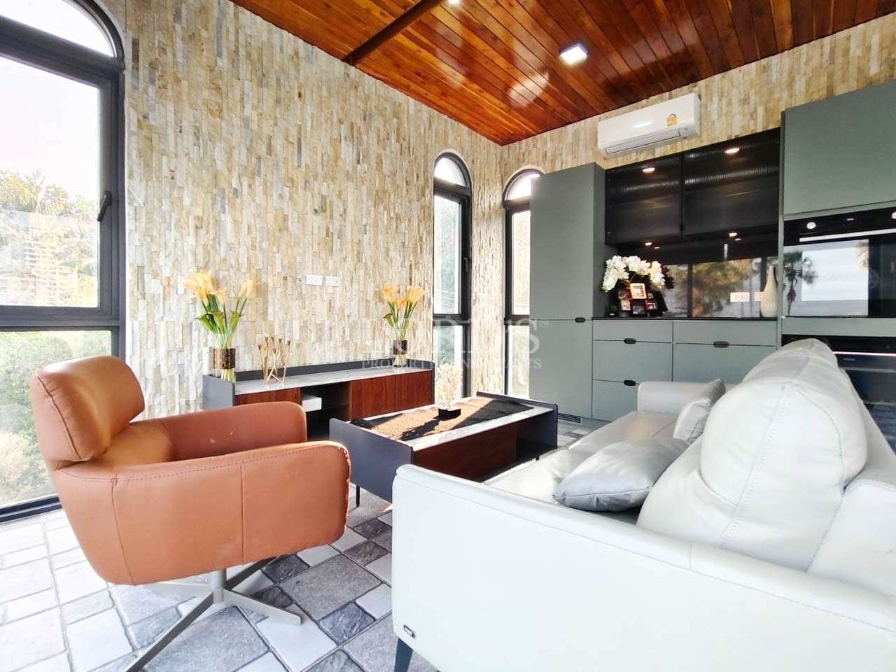 Living room with wooden ceiling and decor