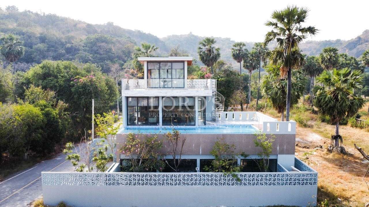 Luxury villa with glass front and pool