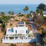 Luxury villa near beach with palm trees