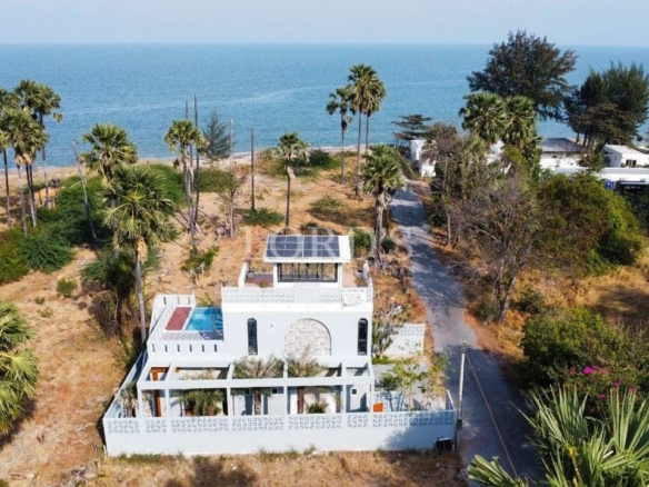 Luxury villa near beach with palm trees