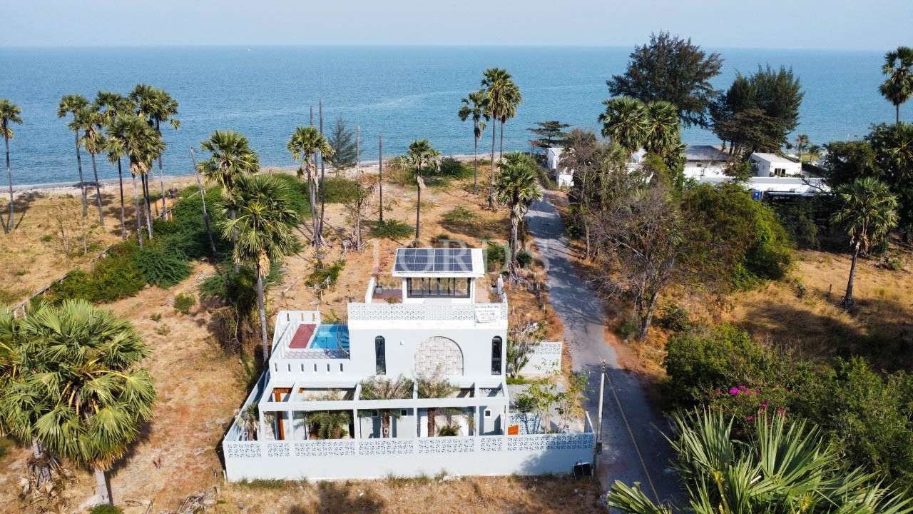 Luxury villa near beach with palm trees