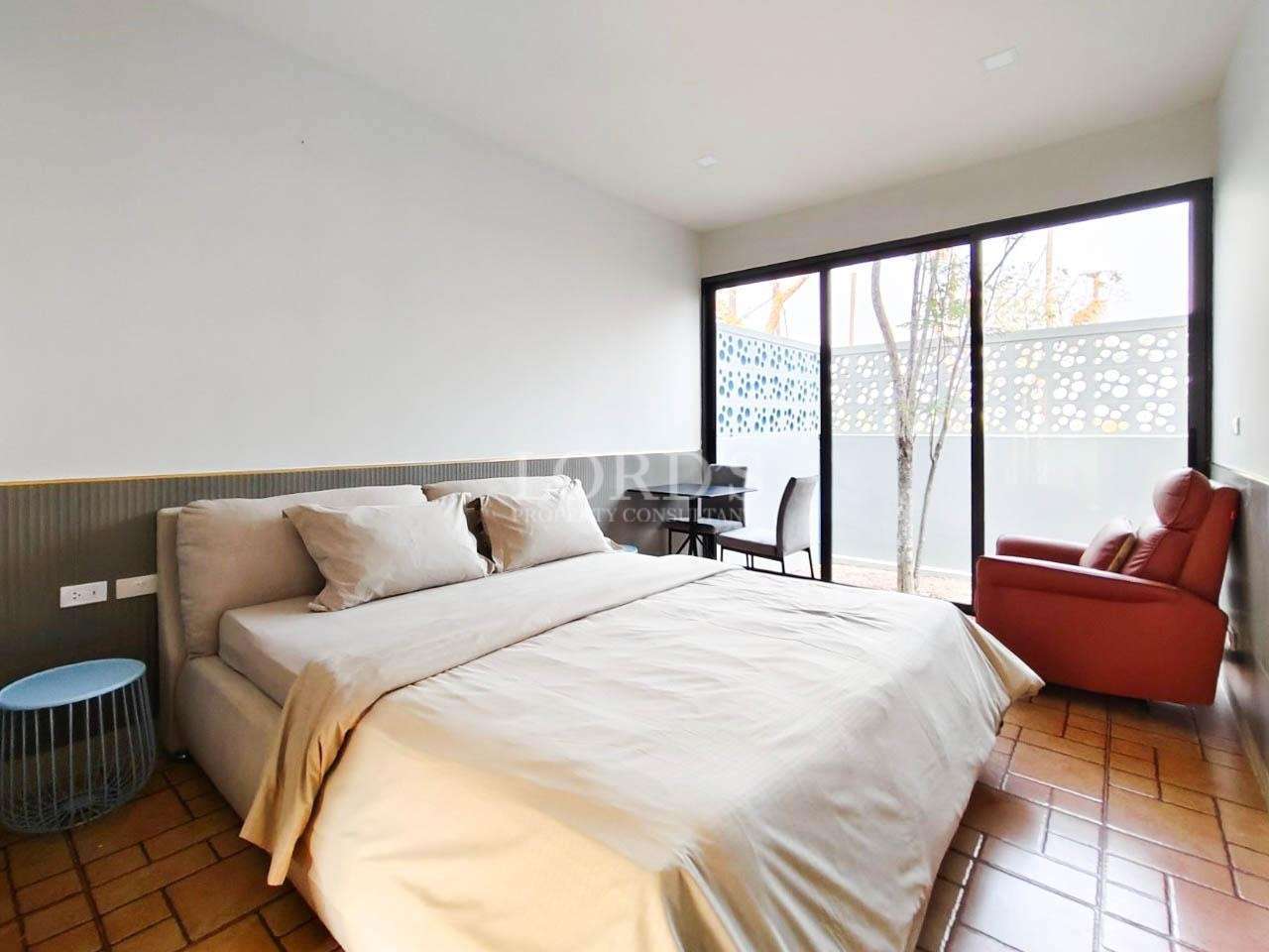Bedroom with large window and natural light